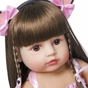 Adorable Doll with Brown Hair and Pink Bows